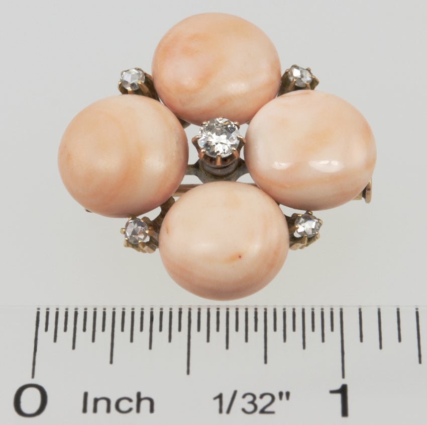Lovely little Victorian pin with four pink coral buttons and five old european cut diamonds that equal approximately .50 carat total weight.