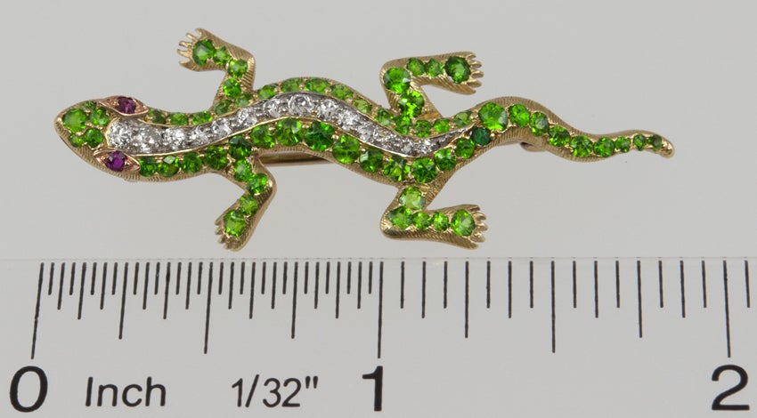 You are going to love this guy! Look at the color of those demantoid garnets! Then up his spine are old european cut diamonds and top it off with ruby eyes.