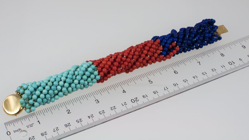 TIFFANY & CO bracelet with 16 strands with three sections of beads.  One section is turquoise, one is coral and one is lapis. Twist and combine all three for a very tropical, fun vacation look!