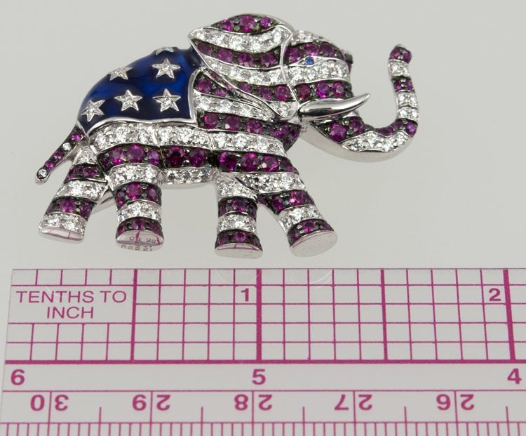Urban legend has it that this pin was given to very large donors to the Republican Party. Great story! No way to substantiate.  It is 18k white gold, with a flag pattern across the body, with approximately 2.5cts of diamonds and 1.75 cts of rubies. 