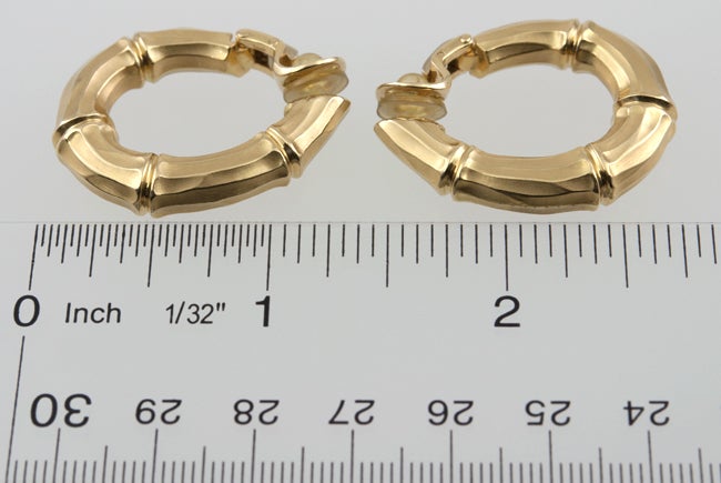 Contemporary Cartier hoops in the very popular bamboo design.  Clip on with hinged opening. Vey chic!