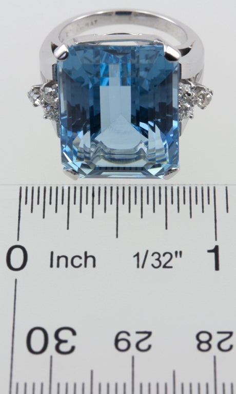 Split shank platinum mounting with .30ct of old european cut diamonds on each side frame a center approximately 22 carat gorgeous blue emerald cut aquamarine.