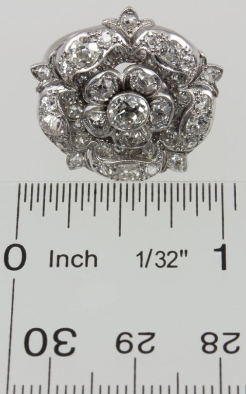 platinum ring with Large elaborate Tudor Rose filled with old european cut diamonds, the center is .50ct and the total weight is 2 carats.