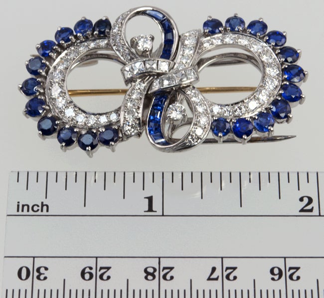 Palladium double dress clips that also attach to a pin back.  It is filled with a great combination of French cut and old european cut diamonds. The total weight is approximately 4 carats. There is an additional 3 plus carats of square cut and old