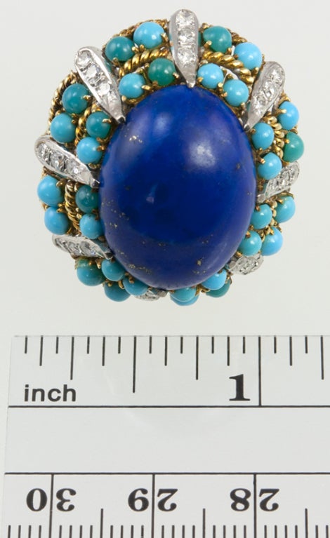 This ring is SO Palm Beach! It would look great with a coral color nail polish and a tan!  Center oval lapis,surrounded by turquoise beads and dividers of diamonds.  All accented with braided 14k yellow gold!