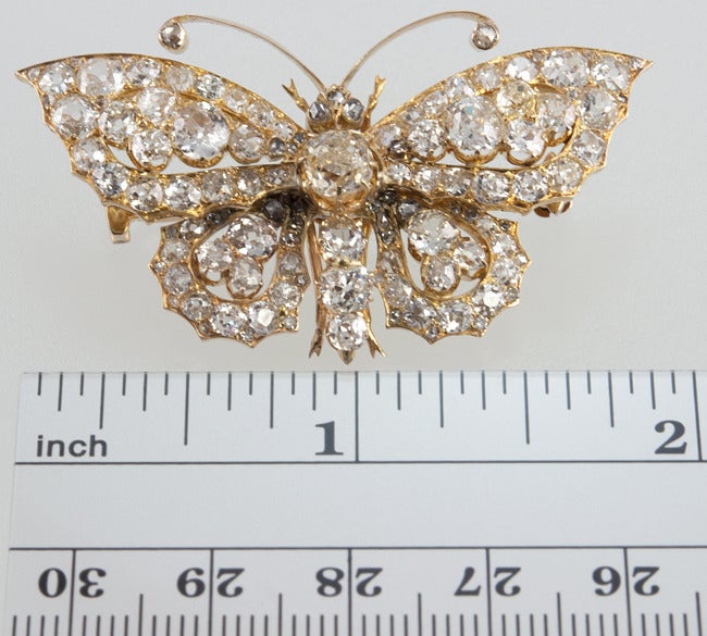 18k yellow gold butterfly brooch filled with 6.5 carats of cushion cut diamonds! Yes! That's right! I said it!  All old ,great, lumpy cushion cuts!  There are four rose cut diamonds on the end of the antennae and as the eyes.  This looks AMAZING in