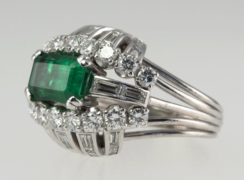 Vintage 1950s Emerald and Diamond Bombe Platinum Cocktail Ring In Excellent Condition For Sale In Los Angeles, CA