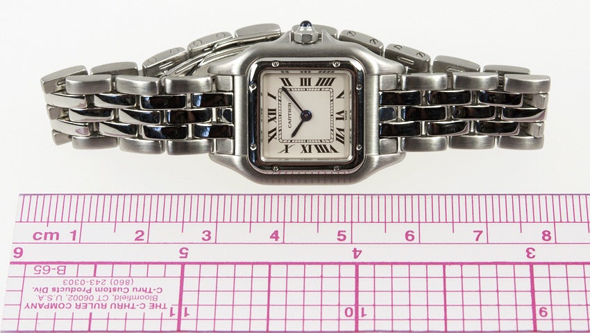 Cartier lady's stainless steel Panther wristwatch, 22mm x 22mm. A classic Cartier style that looks chic and is so comfortable to wear. Quartz movement, sapphire crystal, white dial with blued steel hands. Circa 1990s. This watch includes a one year