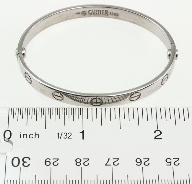 This is a CARTIER 18k white gold size 16 Love Bangle.  It is signed CARTIER and dated 1993. 
*Has the matching screwdriver, no box*