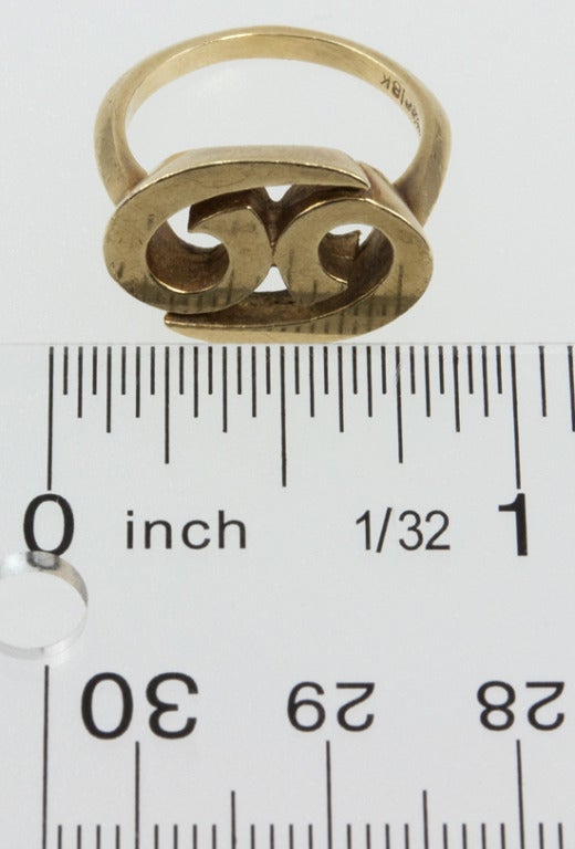 18k yellow gold ring with the intertwined 6 and 9 representing the astrological sign of Cancer.  Signed CARTIER.
*This ring is currently size 7, but can easily be re-sized