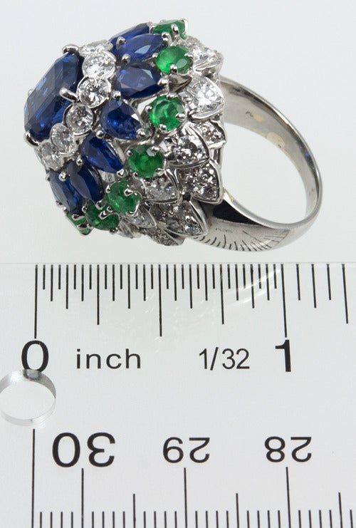 Purchased from the estate of a super chic New York socialite, this platinum cocktail ring will steal the show!  It has three carats of gorgeous round brilliant diamonds, there are approximately 5.75 carats of deep blue sapphires and 1.40 carat of