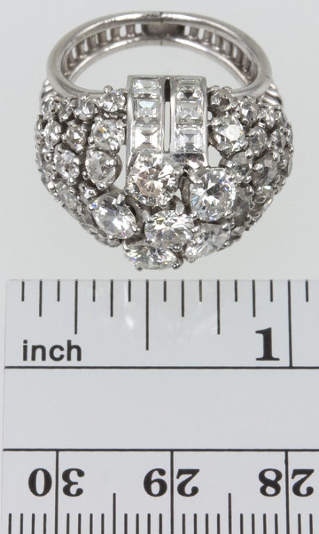 This unique Diamond dome ring has a lot of bling!  It's unique in the fact that it has a mix of diamond cuts.  It has a total of 5 carats of old european cuts, and old square cuts along the top and then the six diamonds that make up the center