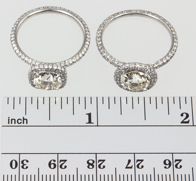 These rings are a unique combination of old and new, and done really well!
The diamonds are both old european cuts, one is 1.96 carats, approximately O-P color, VVS2, and the other is 1.78 carats approximately L-M color, VVS2.
They were then