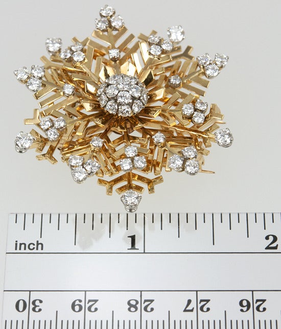 18k yellow gold beautifully and intricately designed snowflake pin. There are numerous  impeccable transitional cut diamonds totaling 5.50 carats are set in platinum. It is signed Van Cleef and Arpels and is spectacular!  These are rare and highly
