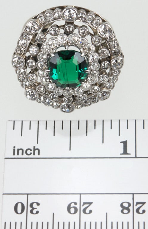 This platinum ring has 2 carats of old european cut diamonds in three circles all around a beautiful step cut oval emerald.  The emerald is 1.53 carats and the color is incredible, deeper green than the computer shows.
*This ring is size 5.75 and