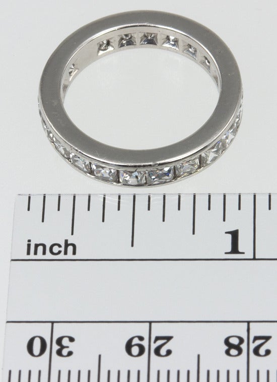 Once upon a time, our jeweler could get these modern French Cut diamonds, so he made a band.  These diamonds are no longer available, so this is a one off, it's never been worn.
The diamond weight is 3.47 carats, the quality is G-H color, VS