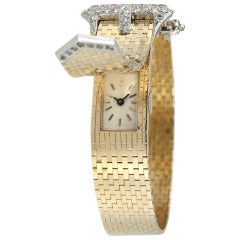 Lady's Yellow Gold and Diamond Retro Concealed-Dial Bracelet Watch