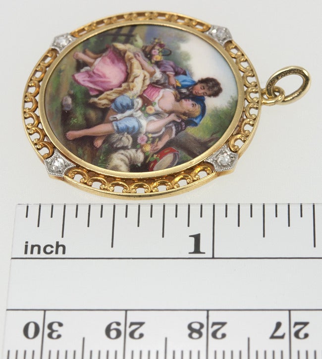 A beautiful Renaissance Scene is painted on this 18 karat yellow gold pendant.  Set with 4 rose cut diamonds and signed Tiffany and Co. on the bale.