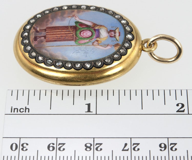 This unusual locket is painted enamel with a womans form with a column for a dress and tools for shoes.  Rose cut diamonds frame the painting all set in 18 karat yellow gold.
Can you identify this woman?  Please email if so.  Thank you.