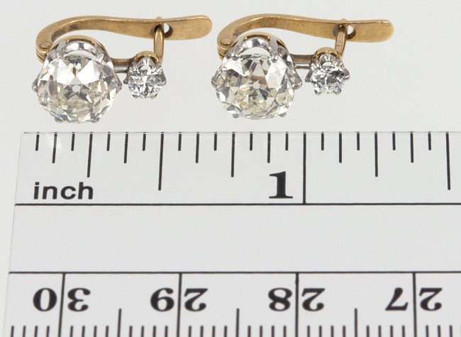 So wearable.  These Victorian Old Mine Cut diamond earrings are set with 2 approximately 1.70 carats (J-K SI-I1) and 2 0.15 carats diamonds.  The diamonds are set in platinum with 18 karat yellow gold backs.