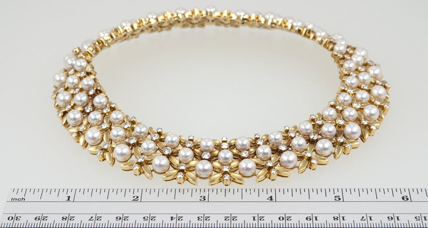 This Tiffany Collar will be gorgeous with your cardigan as well as your best gown.  Gold, Diamond and Cultured Pearl Collar Tiffany & Co., France 18 karat yellow gold with 125 round diamonds approximately 9.75 cts.,and 75 pearls approximately 6.8 to
