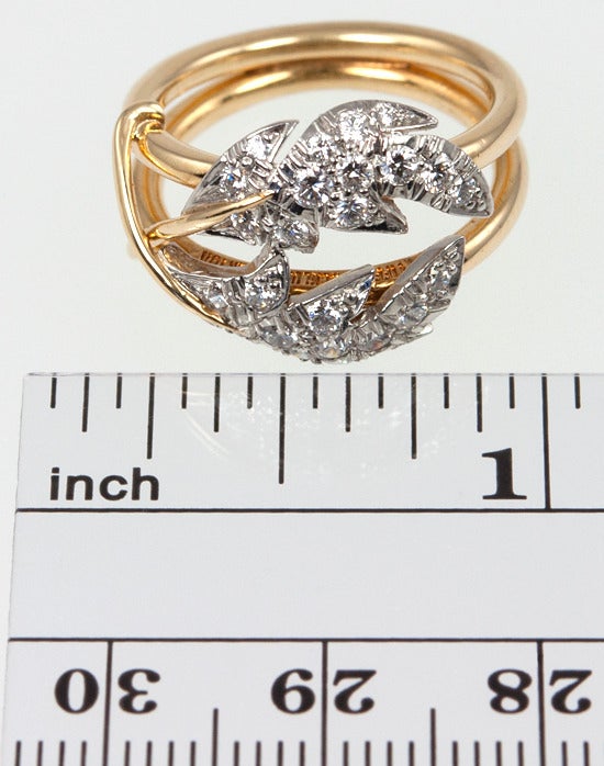 Organic leaves decorate this Tiffany Schlumberger 2 leaves ring.  In 18 karat yellow gold with 0.54 carats of diamonds.  Size 5.5 and easily altered.