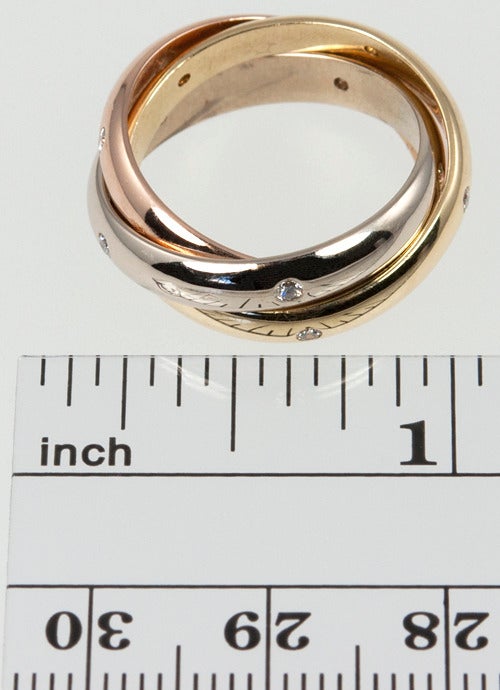 Cartier Trinity Ring with 15 diamonds dated 1999 in size 52 (6).  The current retail is $4300.  This ring cannot be sized.