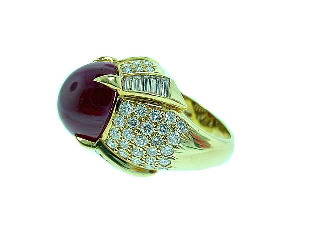 This is a stunning designer ring by KURT WAYNE. . .featuring a large rich red cabochon ruby and approximately 2.75cts of fine white diamonds. . . .
Ring is signed and numbered.