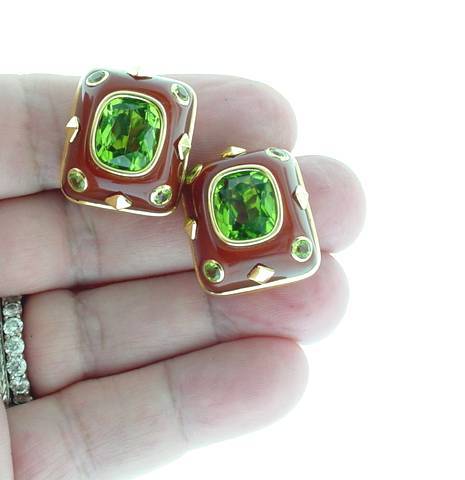 This is an impressive pair of designer earrings by Trianon, featuring gem quality faceted peridots set in carnelian with gold accents. Trianon Markings, French hallmarks too.