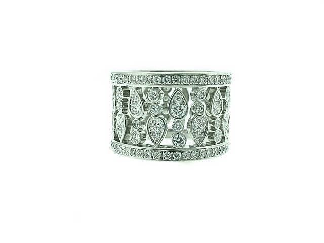 This is a gorgeous ornate wide diamond band by Chopard, featuring approximately 4 carats of fine diamonds. The ring measures 5/8