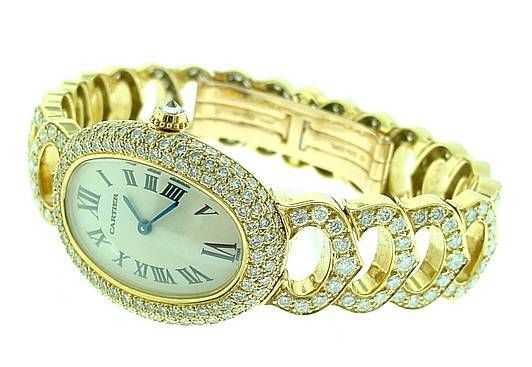 This  is  an  incredibly  gorgeous  Cartier  diamond  watch,  from  the  Baignoire  Collection. . . .featuring  signature  diamond  C  bracelet. . .watch  was  made  in  limited  production. . .all  Cartier  factory  diamonds. . .all  original 