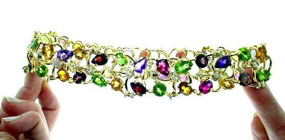 Juicy and Gemmy!!!  This smashing Chanel 18K yellow gold and multi gemstone choker with diamond accents. A rare find!!!