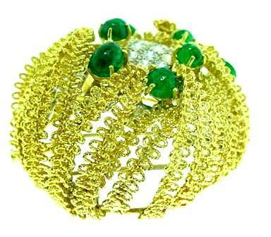 This is a magnificent emerald and diamond pin by CARTIER. . .
featuring approximately 4.50cts of diamonds and 3.00cts of cabochon emeralds.