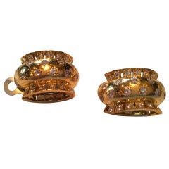 Van Cleef 
Arpels gold and diamond earrings, circa 1950.