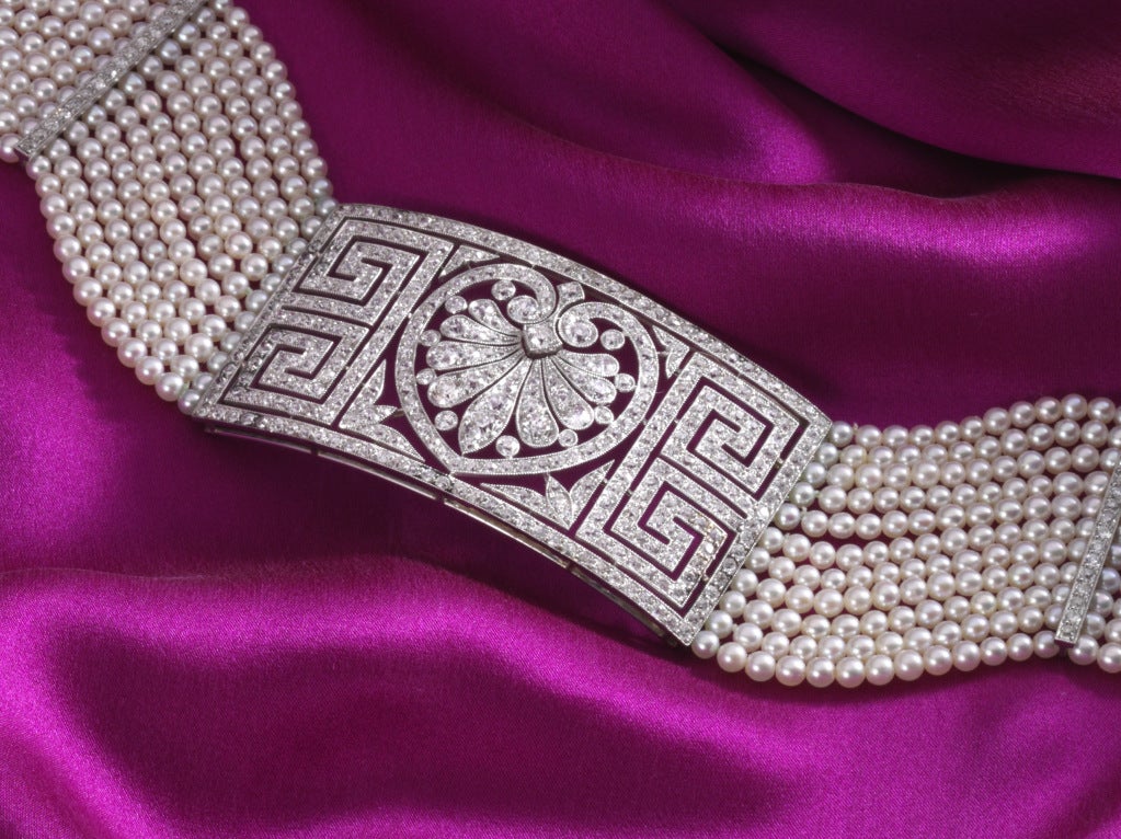 This piece possesses 11.5 cts. of diamonds and nearly 900 natural oriental pearls.