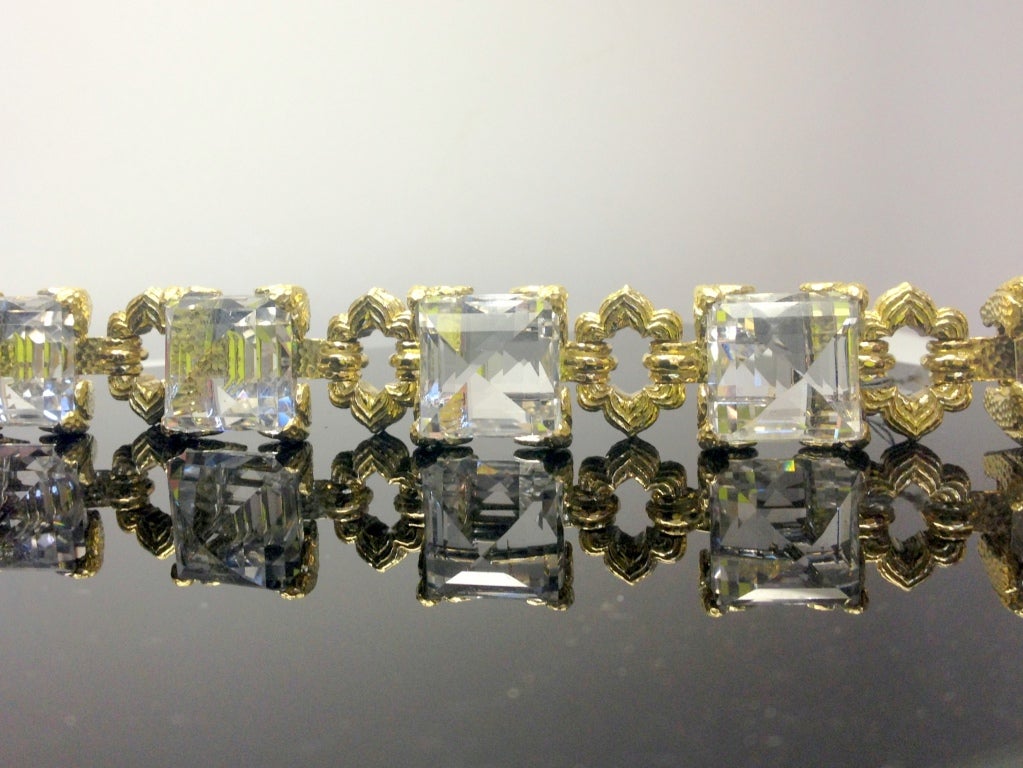 18K yellow gold links possessing five very fancy cut clear white  facetted rock crystal, approximately 250 cts.  C. 1965