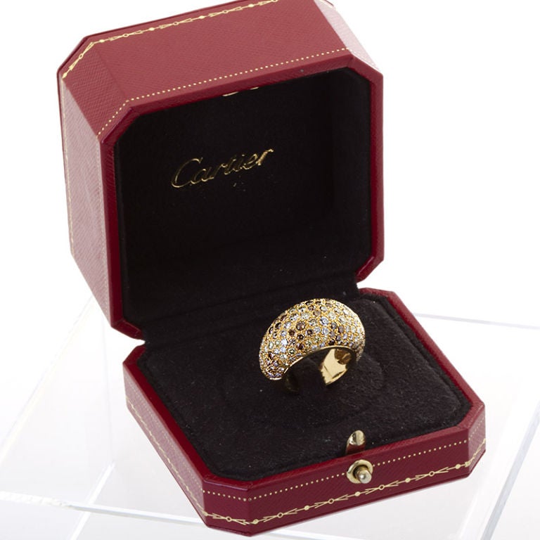 Cartier dome shaped ring with diamond pave of fancy color and white diamonds.