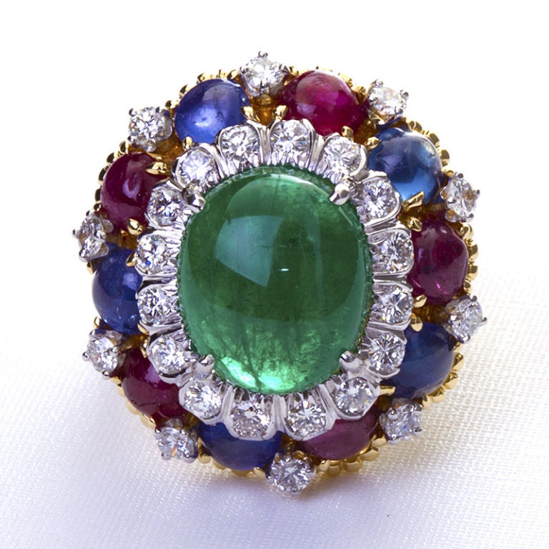 Exquisite David Webb multi-color 18k gold and platinum ring with cabochon emerald center set in a circle of diamonds and surrounded by cabochon rubies and sapphires.  A wonderful find and one of a kind.