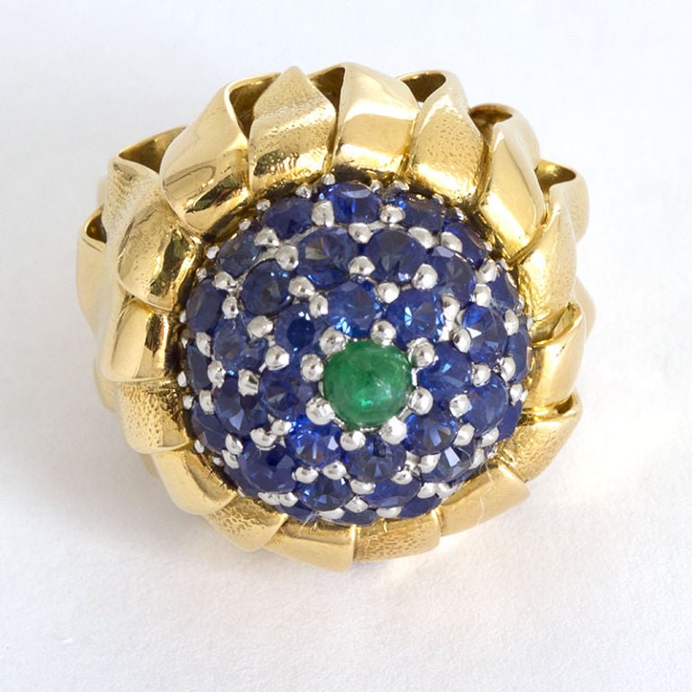 TIFFANY & Co. Jean Schlumberger Gold and Sapphire Thistle Ring.<br />
Cabochon center emerald.