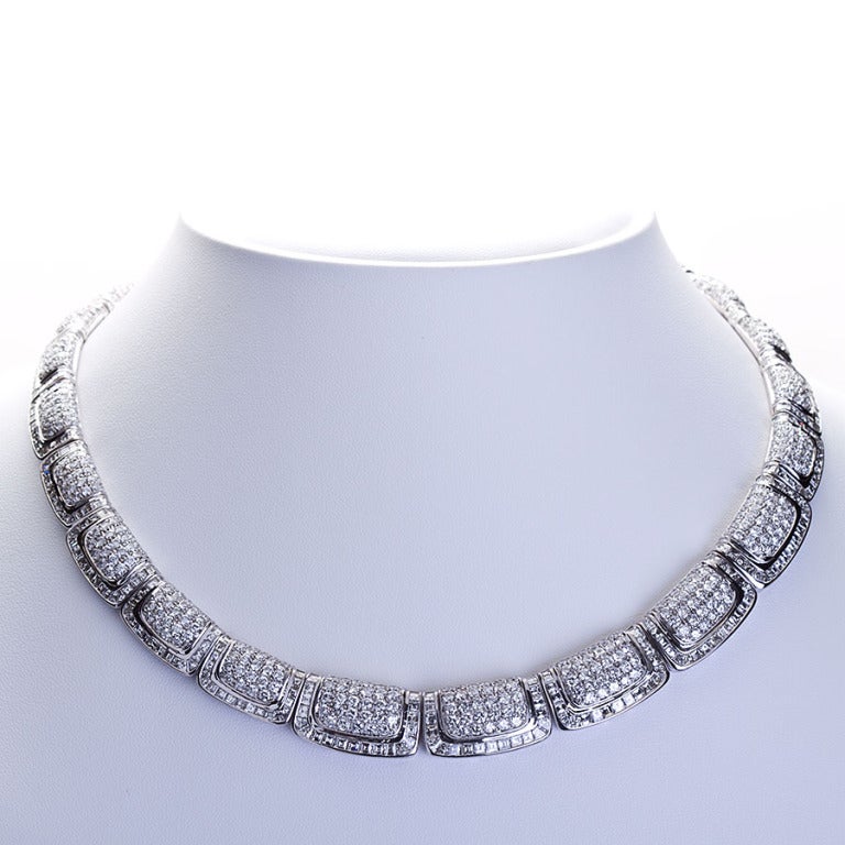 Diamond inlaid 18 karat white gold necklace with a fabulous Egyptian revival Art Deco styled motif.  This remarkable necklace contains approx. 47 ctw of very fine diamonds.  This sits close to the neck and is approx. 16 inches long.

No. 4301