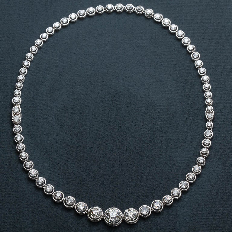 A diamond rivière necklace fit for royalty. Magnificent workmanship and outstanding diamond placement. Features a wonderful 3.20 carat center old European cut with graduating diamonds set in a hybrid basket bezel style platinum mountings. 65 Stones