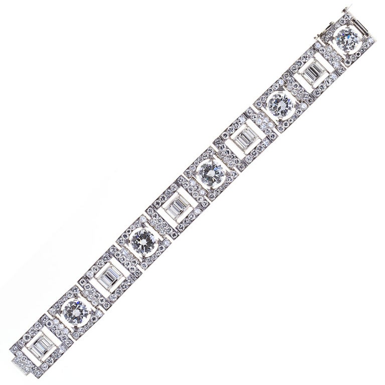 An impeccable Art Deco diamond bracelet with five large round brilliant diamonds weighing 13.25 total carats. Center stones all have GIA reports of F-H color and VS1-2 clarity. Surrounded by ~14 carats of very high quality (D-F/VVS-VS1) round