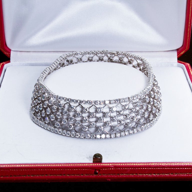 A diamond in platinum choker necklace in a lattice like design. Contains approx. 80 carats of collection quality round brilliant diamonds. By Cartier. In original fitted Cartier display box.

Dealer ref. 5285
_
TMW Jewels Co. is a family owned