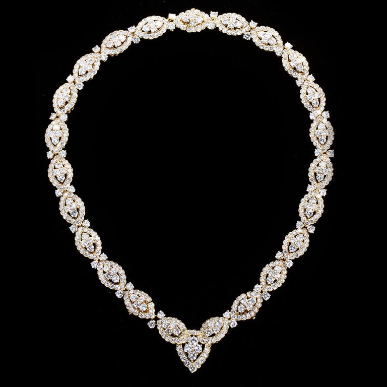 A circa 1965 diamond in 18k yellow gold necklace that converts into two bracelets. Signed makers mark for Van Cleef & Arpels. Approximately 45cts. As a necklace it's 18