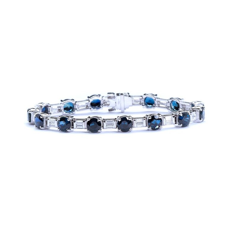 A very unique sporty diamond and sapphire bracelet with a removable outer gold 
