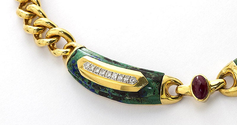 David Webb malachite and gold chain necklace with cabochon rubies and diamond pave accents.

Dealer ref. 2276