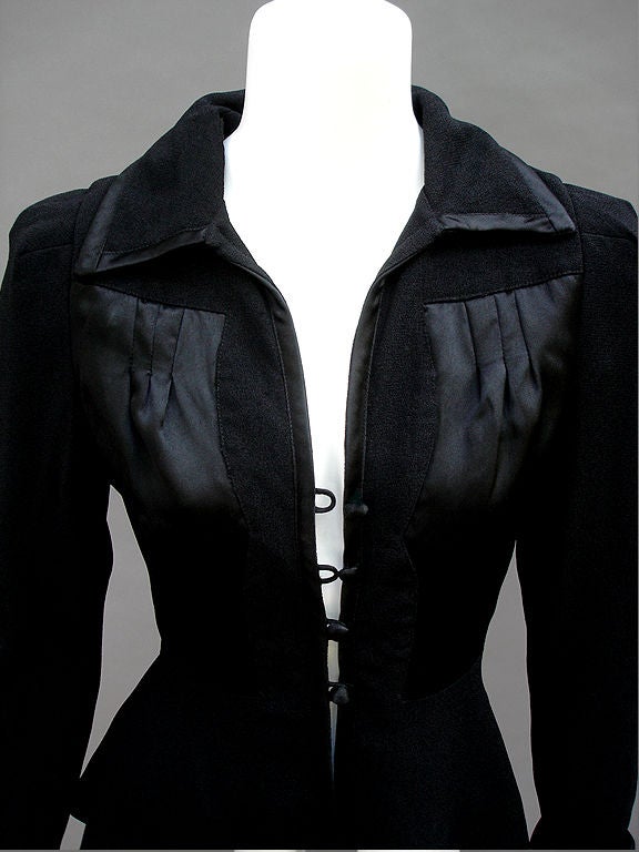 This Jacket - So -So Ossie, Works A Magic Spell...Super 40s Inspired...Cut With Precision And Fits Like A Dream.Signature Black Moss Crepe Fabric With Black Satin Details... Cuff Sleeves And Cinched In Waist... Fabric Covered Buttons With