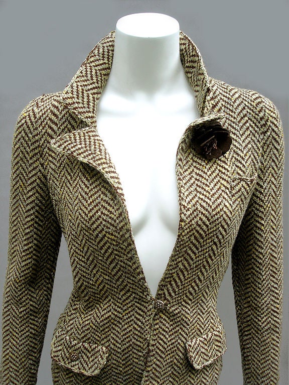Chic knit wool jacket by Adolfo at Saks Fifth Avenue . . . The knit is fantastic . . . Classic herringbone pattern . . . Almost like a cardigan, this is a sweater-jacket . . . Cut slim everywhere . . . Skinny fit . . . Three carved golden buttons at