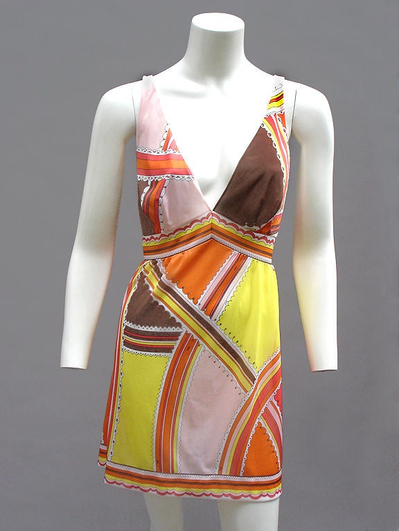 Amazing Pucci mini dress in thinnest nylon jersey . . . Cut like a tiny Roman toga . . . Empire waist and fuller skirt . . .  Super sexy plunging back and deep vee in front . . . 

The colors used are shell pink, cocoa, pale lemon, tangerine, and