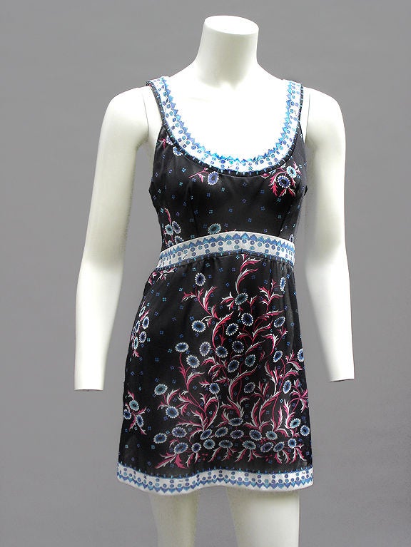 Amazing Pucci mini dress in thinnest nylon jersey . . . Super sexy scoop design  . . . 

We love this print, which we call noir floralette . . . The colors used are black, hot coral, shades of aqua and cerulean, and electric lilac . . . Print is